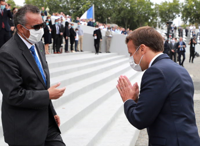 The WHO director with French president Macron