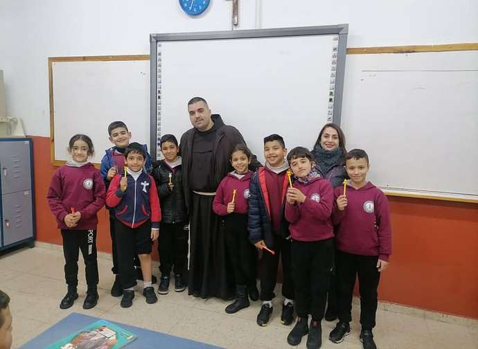 Father George Haddad with some students