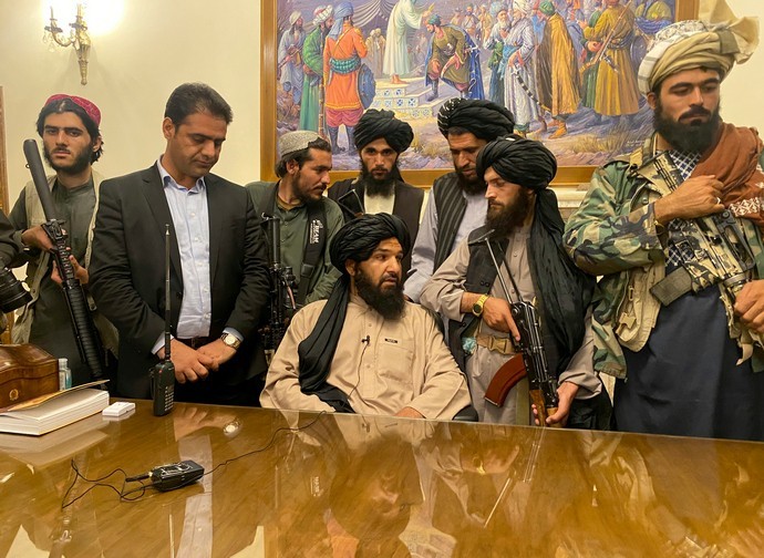 Taliban militants in the Presidential Palace in Kabul